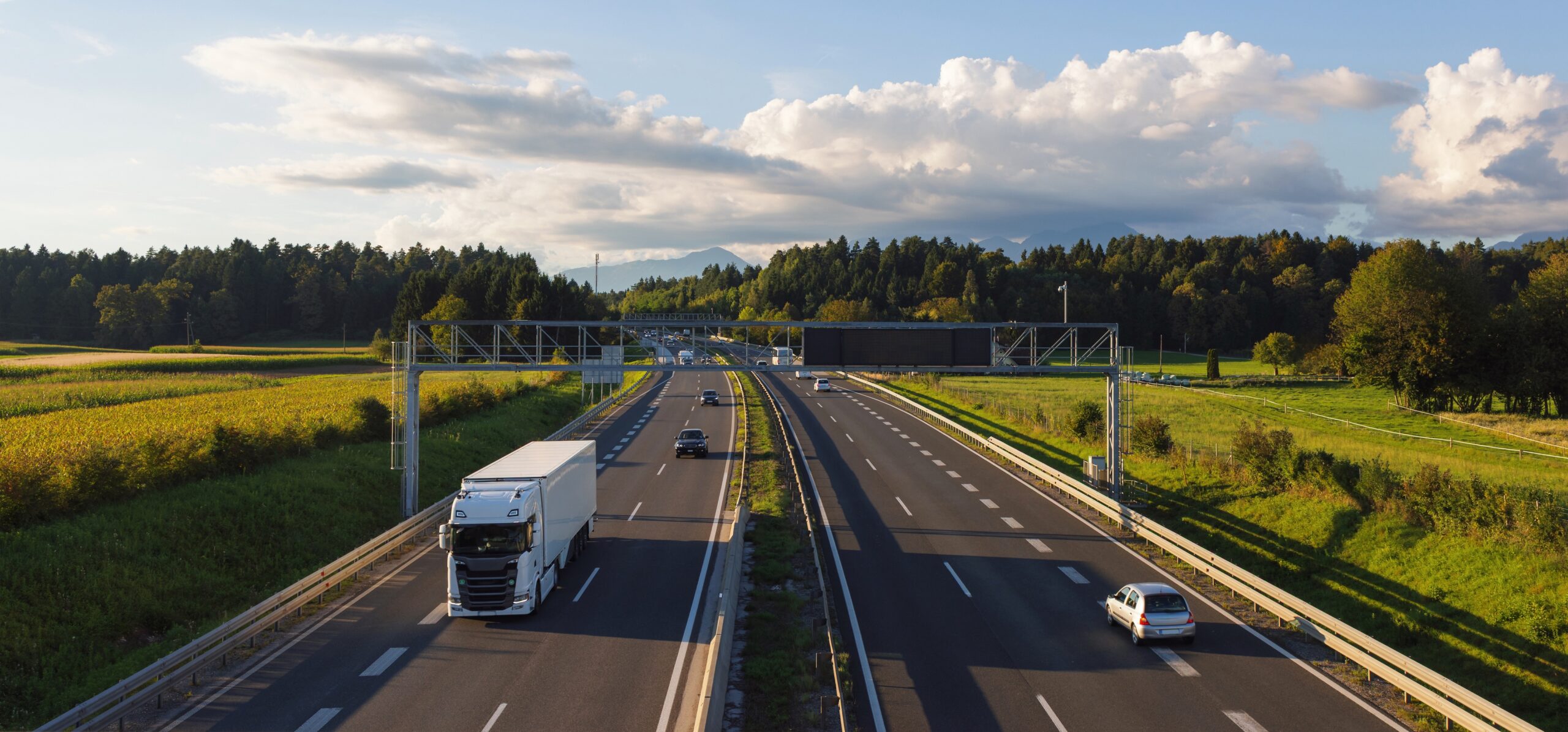Trucks on highways aiding freight transport and delivery systems